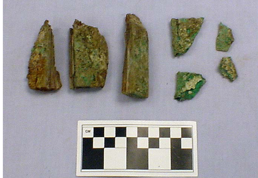 Pieces of a hinge and lumber from Feature 20 at Market Street Chinatown.