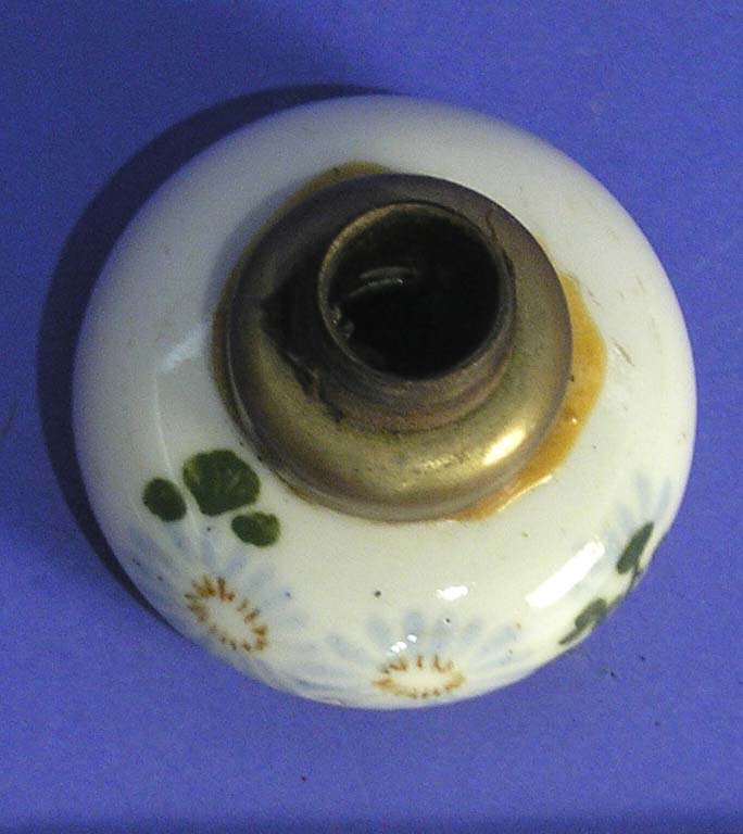 Ceramic opium pipe burner with a metal fitting from a Chinese migration collection.